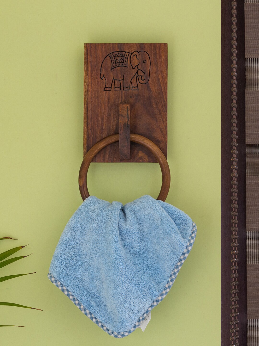 

ExclusiveLane Brown Handcrafted The Elephant Warriors Sheesham Wooden Ring Towel Holder