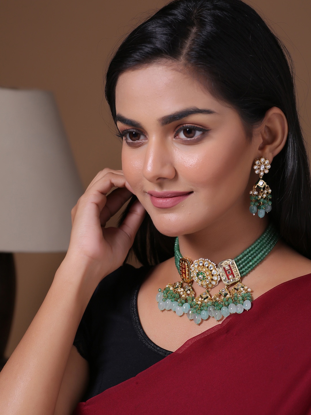 

Shoshaa Gold-Plated Green & White Kundan-Studded Beaded Jewellery Set