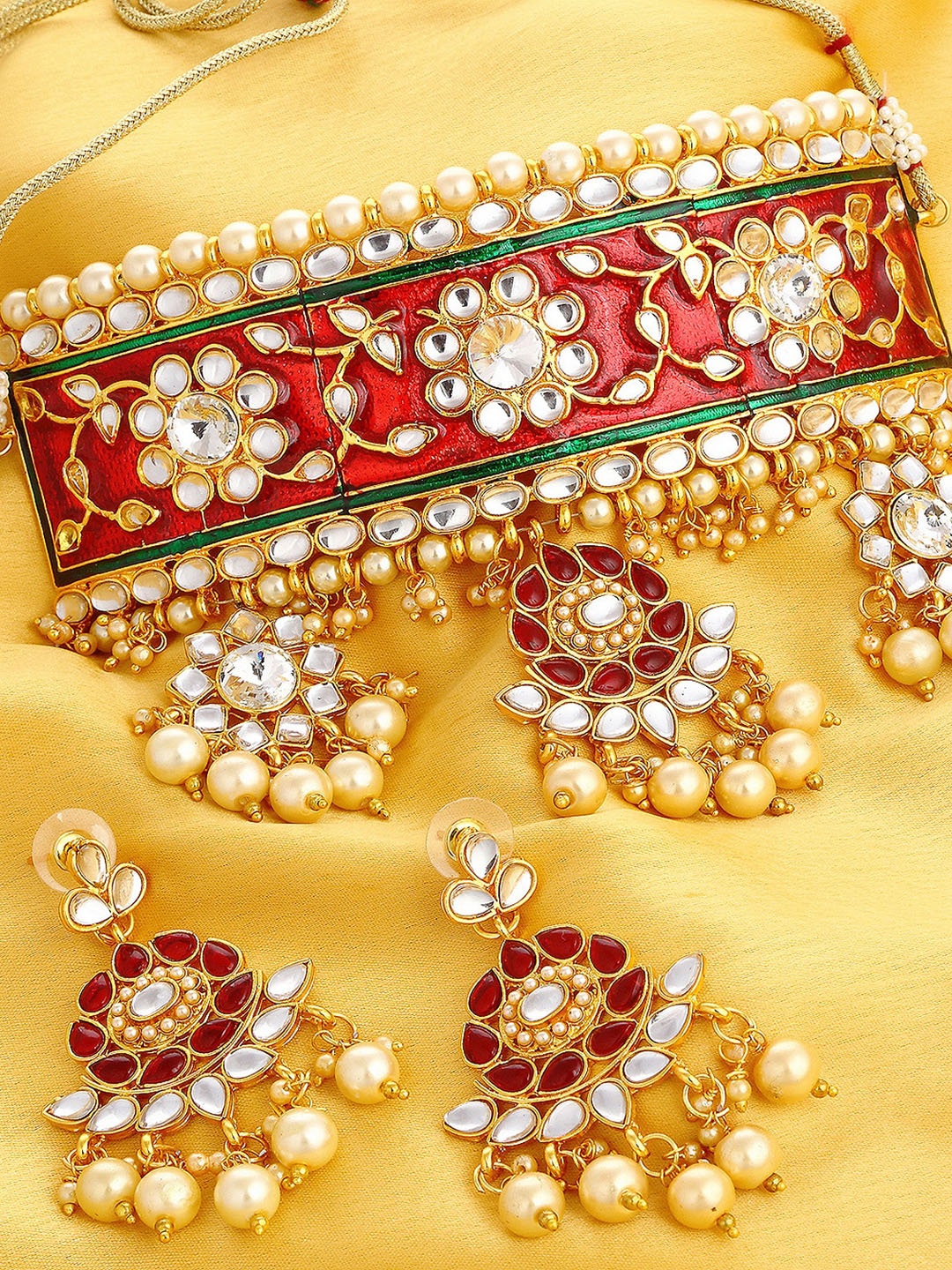 

Sukkhi Gold-Plated Red & White Padmavti Inspired Pearl & Kundan Enamelled Jewellery Set