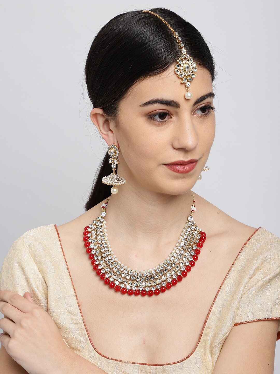 

Sukkhi Gold-Plated White & Red Kundan-Studded Beaded Jewellery Set