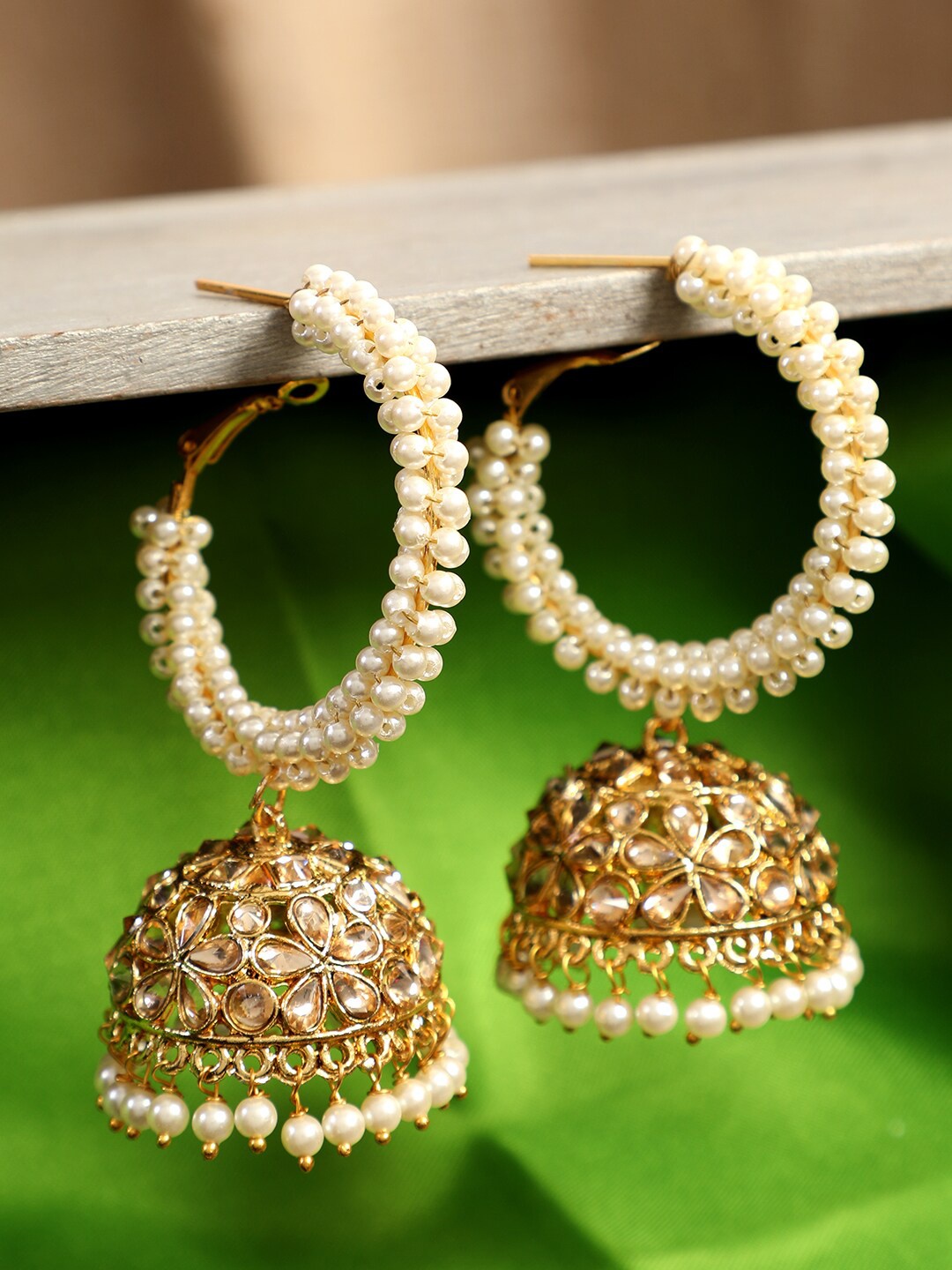 

ANIKAS CREATION Off-White & Gold-Plated Pearl Embellished Dome Shaped Jhumkas