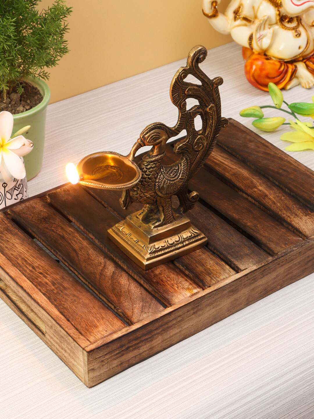 

Imli Street Gold-Toned Peacock Shaped Lamp Diya