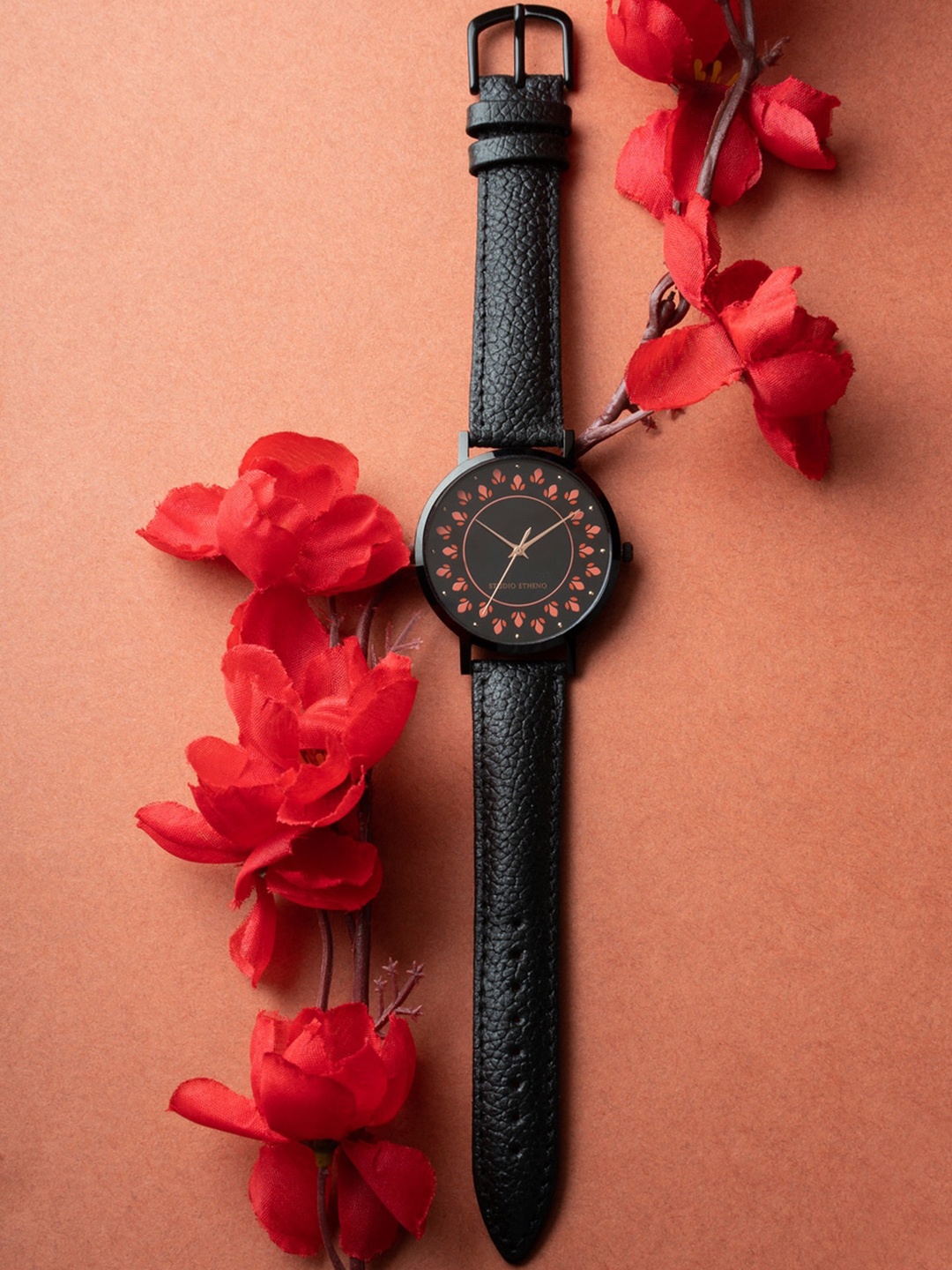 

STUDIO ETHENO Women Black & Orange Analogue Watch SD3-ETHENIC