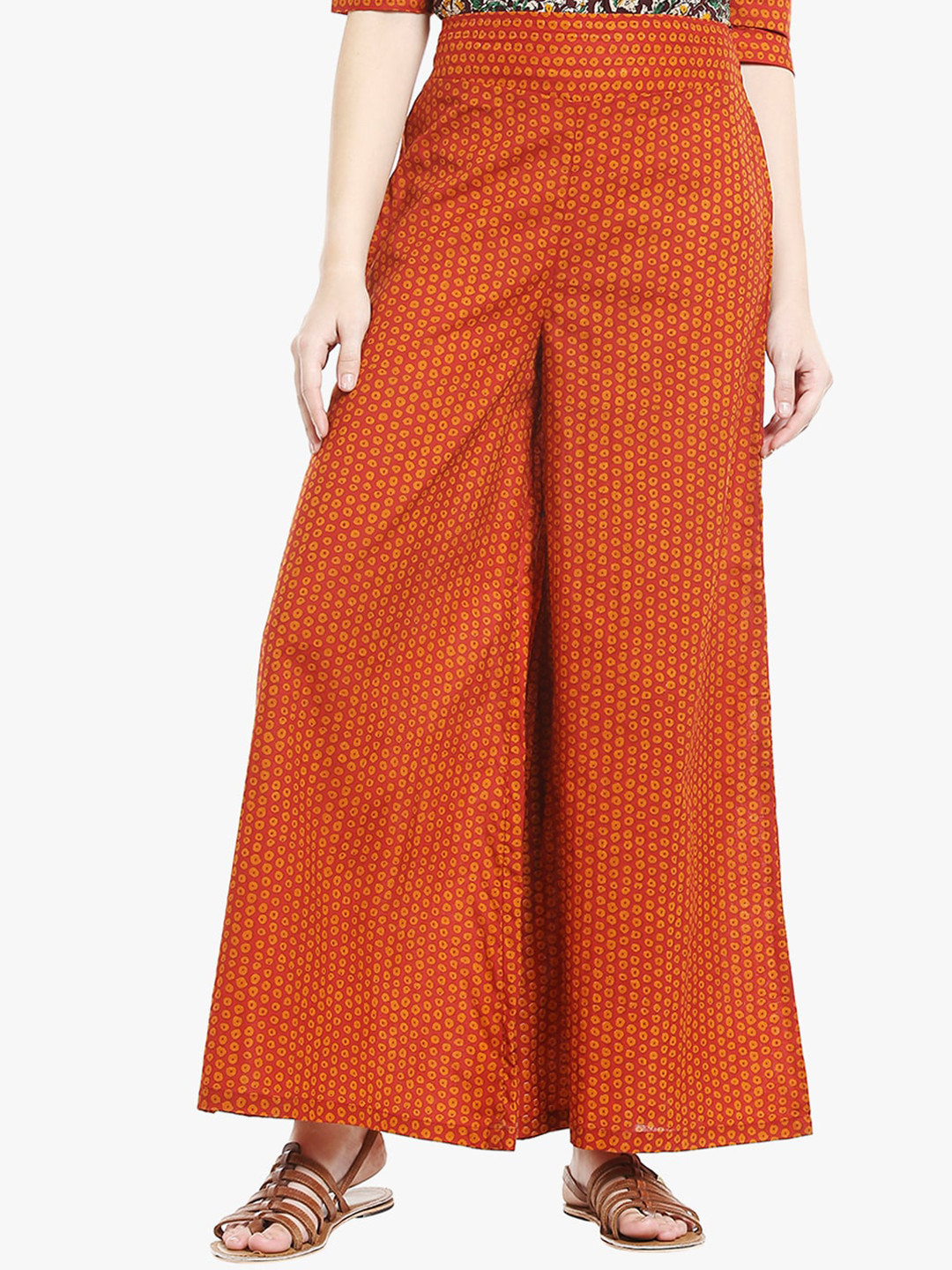 

Desi Weavess Women Rust Orange & Yellow Printed Flared Palazzo
