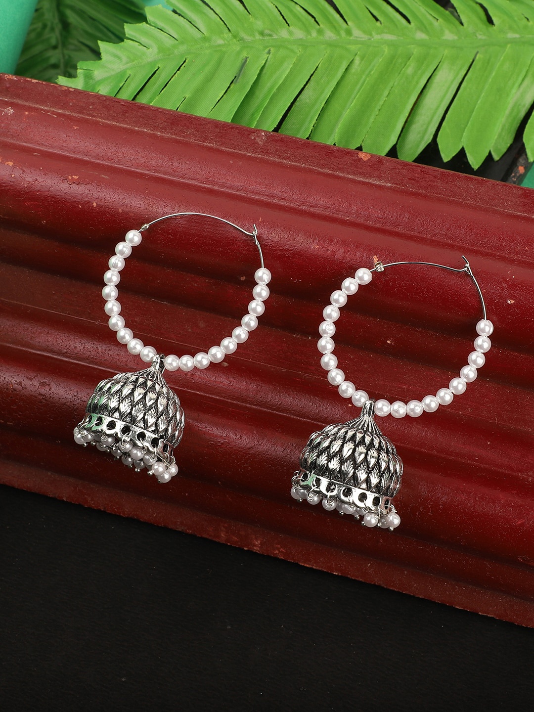 

ANIKAS CREATION Silver-Toned & White Dome Shaped Jhumkas