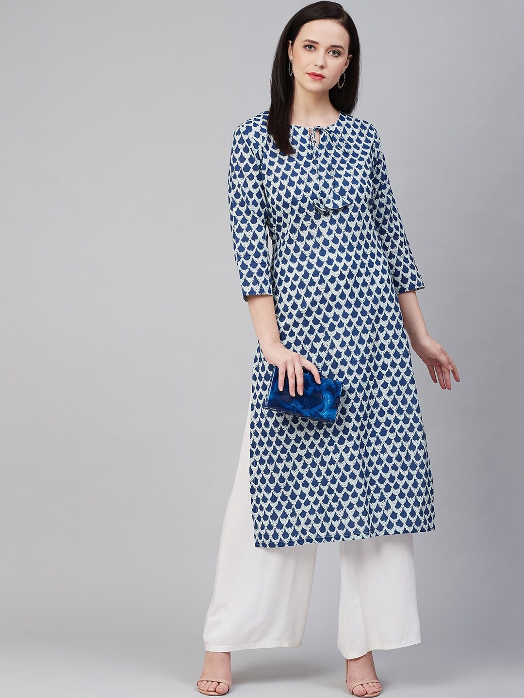 

Bhama Couture Women Blue & White Printed Cotton Kurta with Palazzos