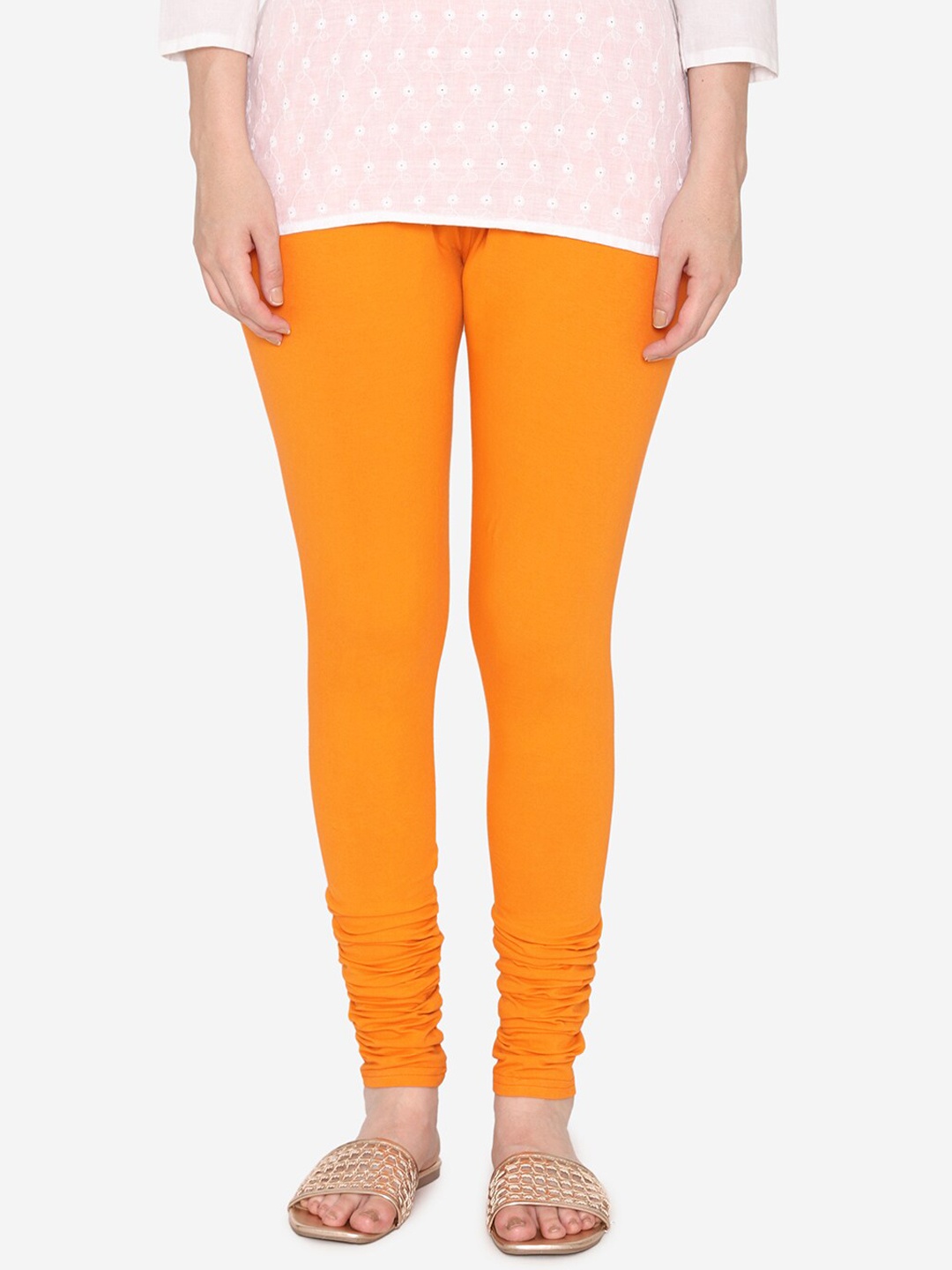 

Vami Women Orange Solid Churidar-Length Leggings