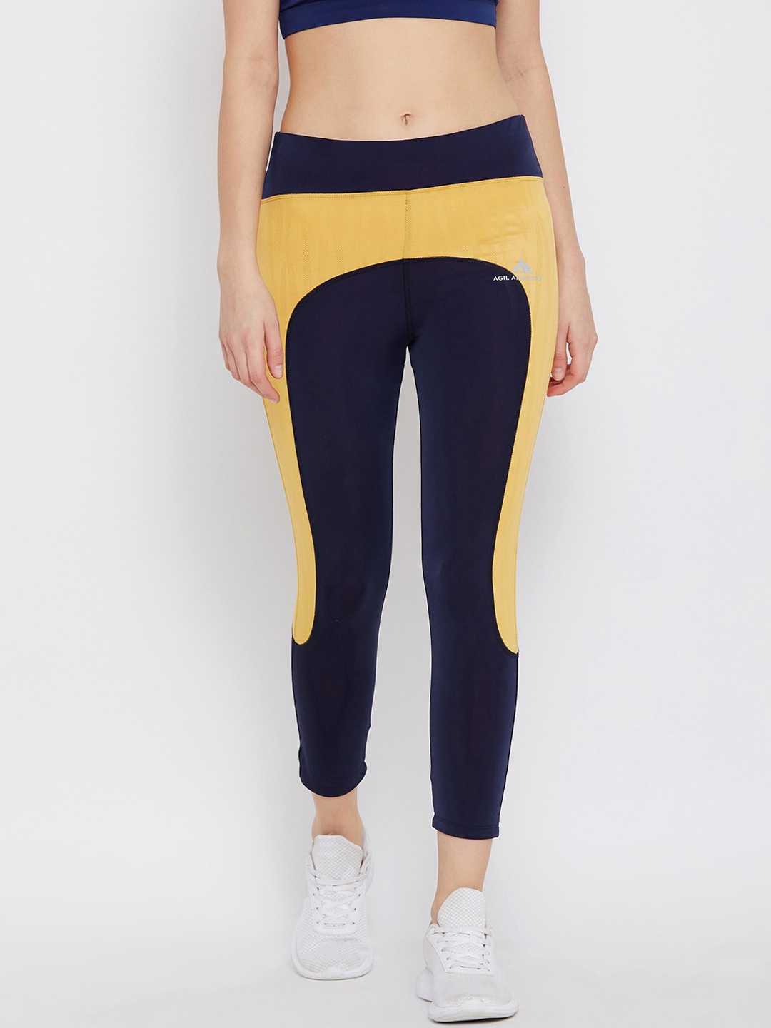 

AGIL ATHLETICA Women Blue & Yellow Solid Ankle Length Training Tights