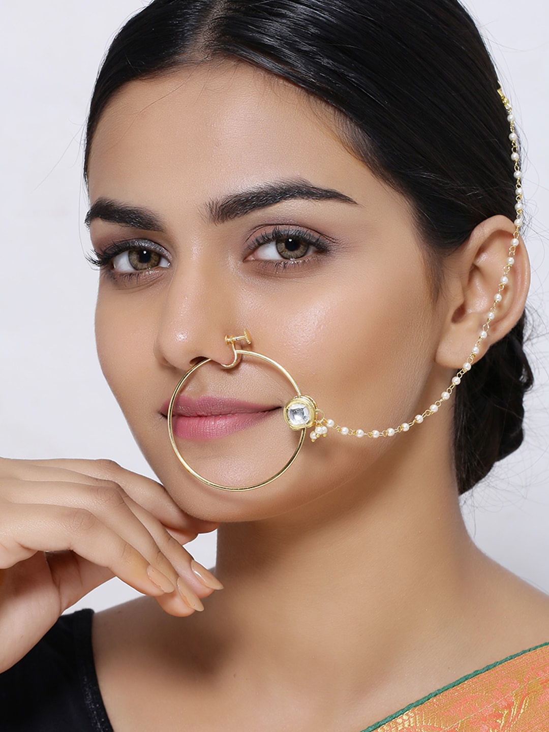 

Shoshaa Gold Plated White Kundan Stone Studded Nose Pin with Beaded Extension