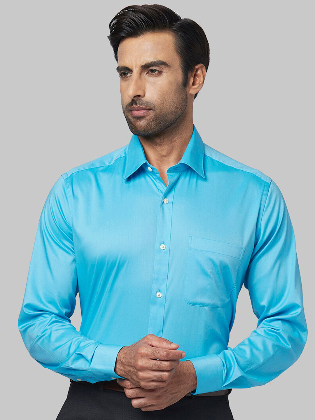 

Raymond Men Blue Solid Formal Shirt
