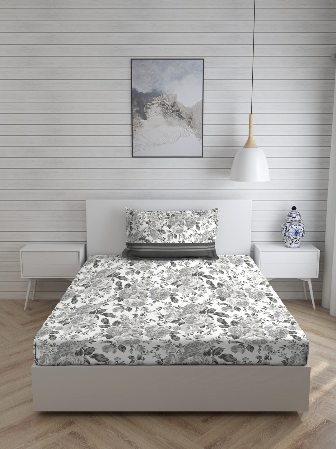 

Layers Grey & White Floral Printed 144 TC Cotton Single Bedsheet With Pillow Cover