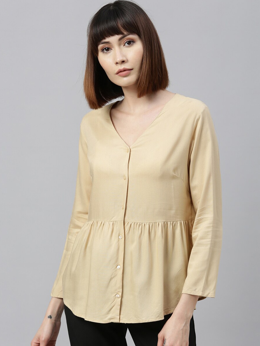 

Park Avenue Woman Beige Solid Peplum Top