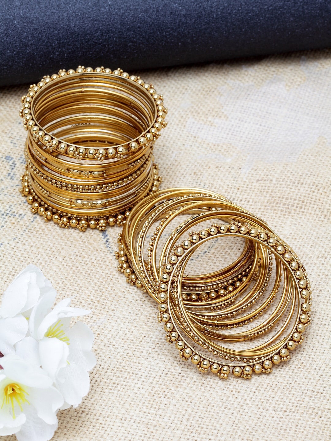 

Shining Diva Set Of 40 Gold-Plated and White Crystal-Studded Antique Bangles