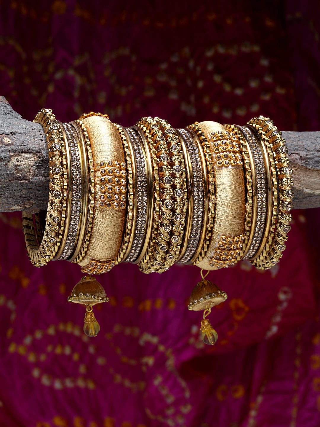 

Shining Diva Set Of 18 Gold-Plated & Beige Stone-Studded Antique Bangles