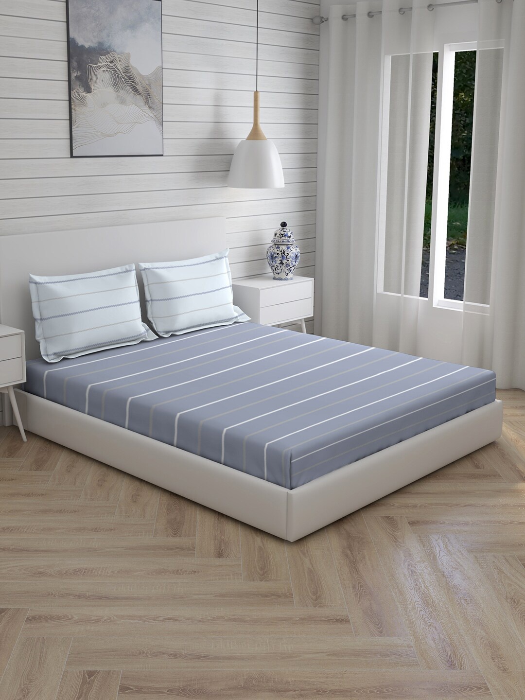 

Layers Blue & White Striped 104 TC Cotton 1 Queen Bedsheet with 2 Pillow Covers