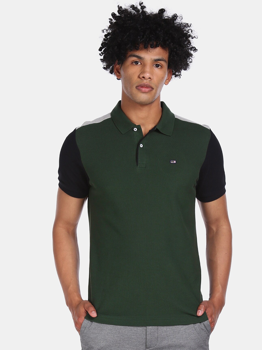

Arrow Sport Men Green Solid Polo Collar T-shirt
