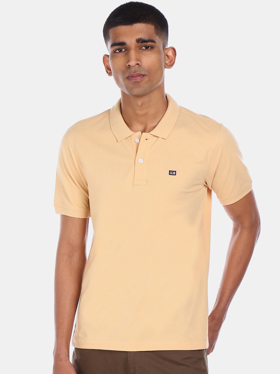 

Arrow Sport Men Beige Solid Polo Collar T-shirt