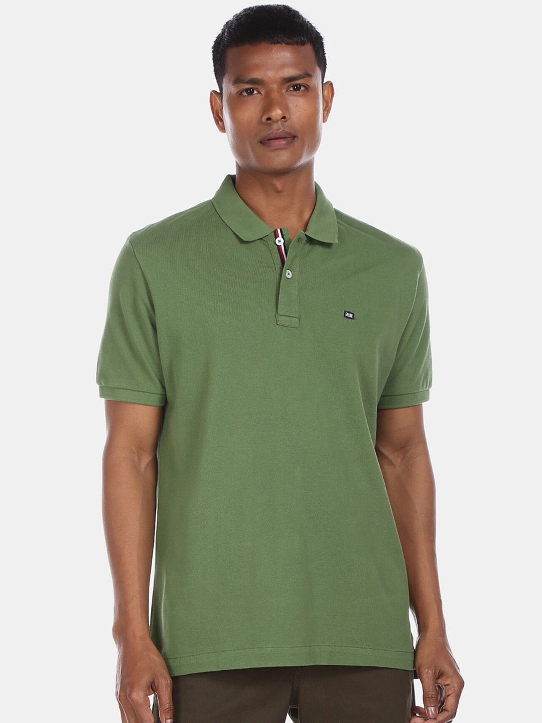 

Arrow Sport Men Green Solid Polo Collar T-shirt