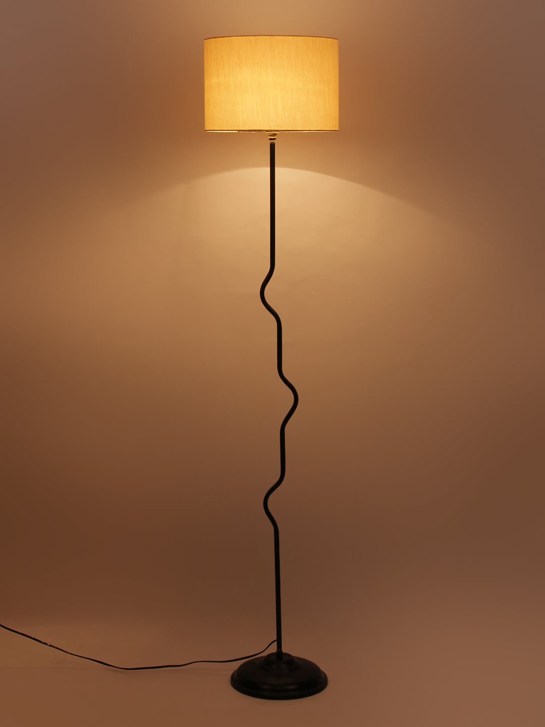 

Devansh Beige & Black Solid Curvy Novelty Lamp