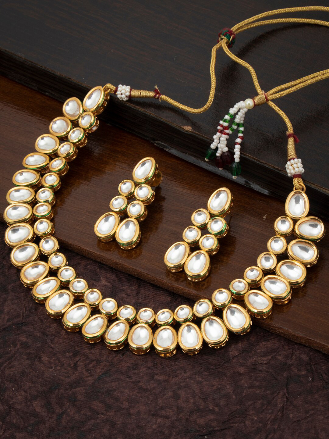 

Sukkhi Gold-Plated White Kundan-Studded Antique Jewellery Set
