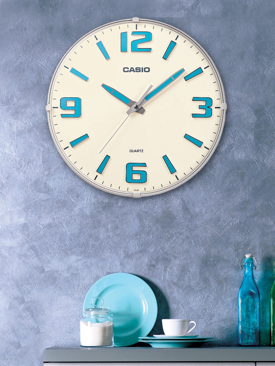 

CASIO White & Turquoise Blue Round Solid Analogue Wall Clock