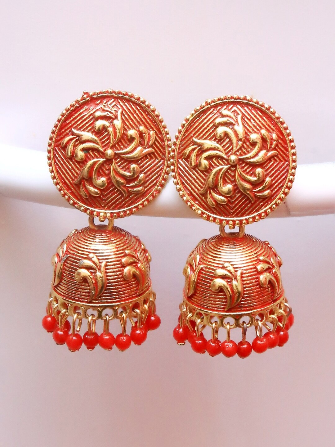 

Crunchy Fashion Red Gold-Plated Dome Shaped Jhumkas