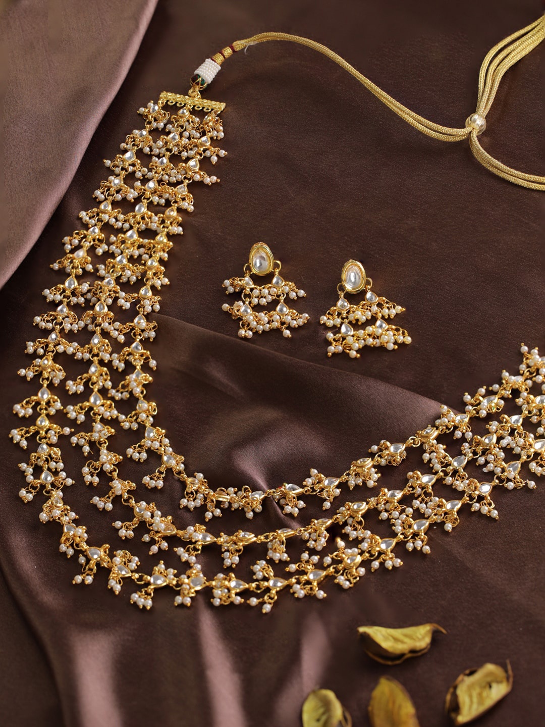 

Priyaasi Gold-Plated White Kundan-Studded Beaded Layered Handcrafted Jewellery Set