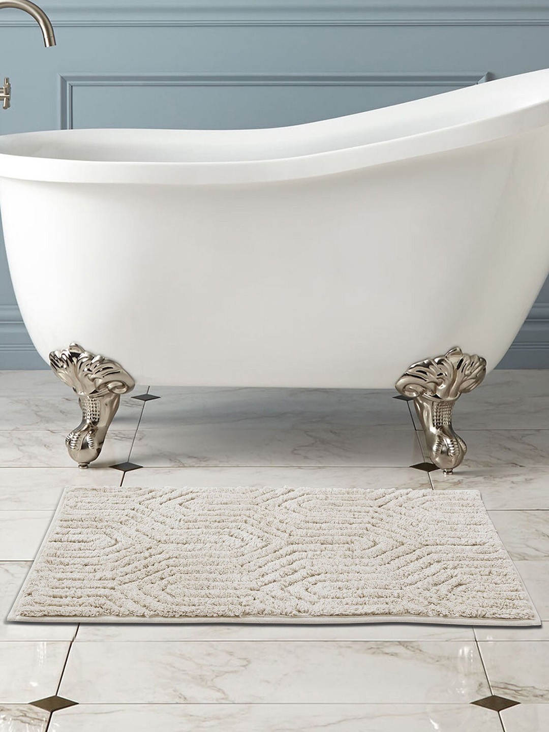 

OBSESSIONS Off White Self Design Rectangular Bath Rug