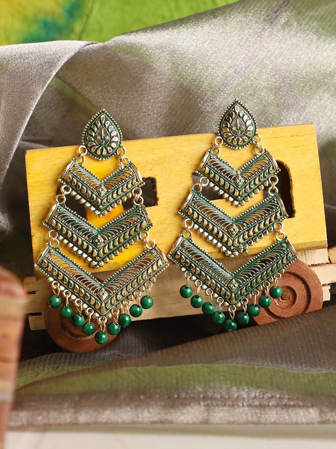 

ANIKAS CREATION Green Oxidised Gold Plated Drop Earrings