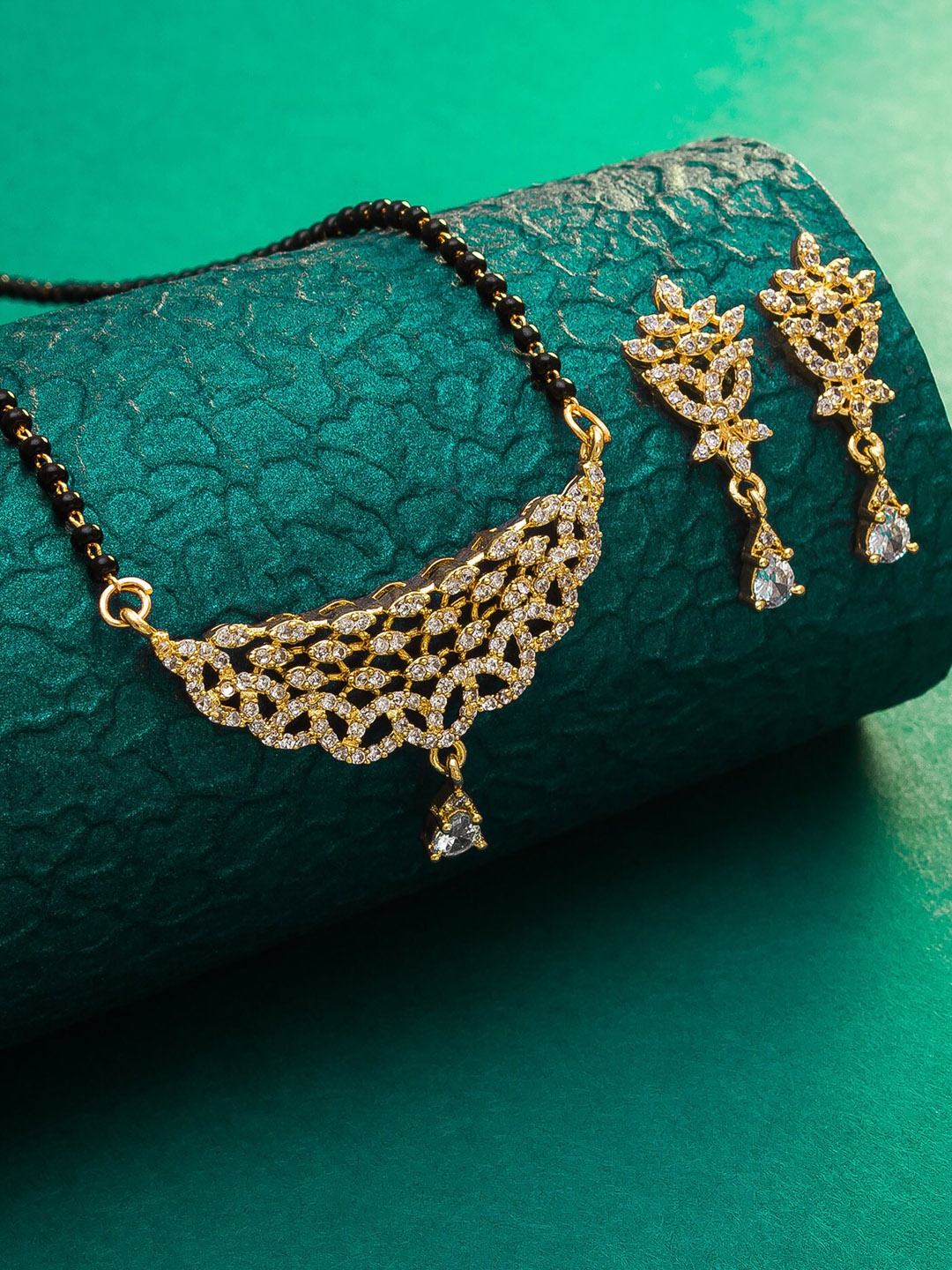 

aadita Gold-Plated Black & White AD-Studded & Beaded Mangalsutra With Earrings