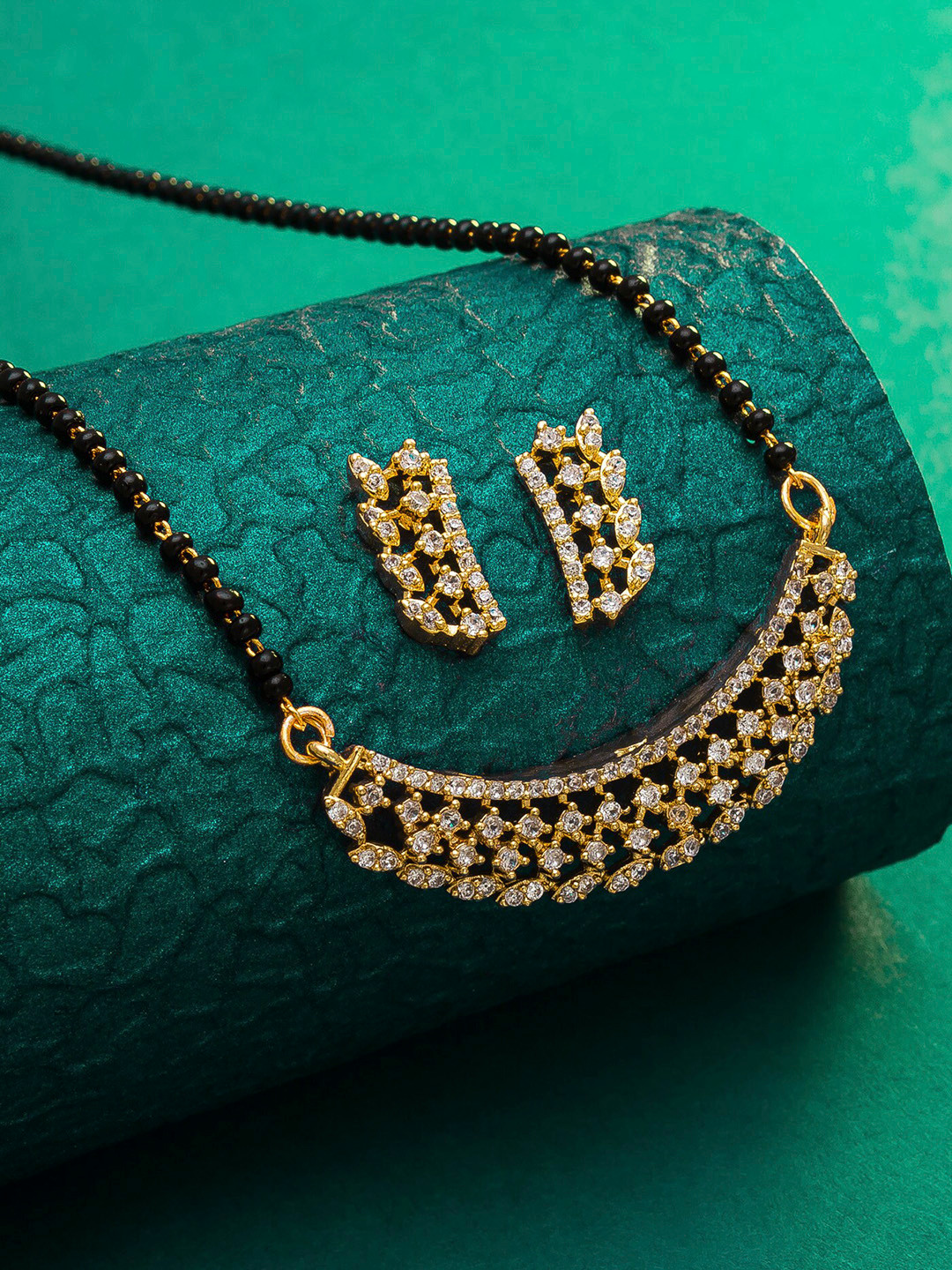 

aadita Gold-Plated Black & White AD-Studded & Beaded Mangalsutra With Earrings