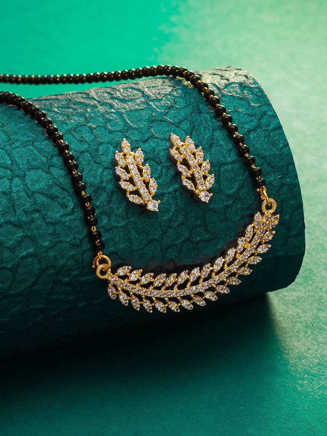 

aadita Gold-Plated Black & White AD-Studded & Beaded Mangalsutra With Earrings