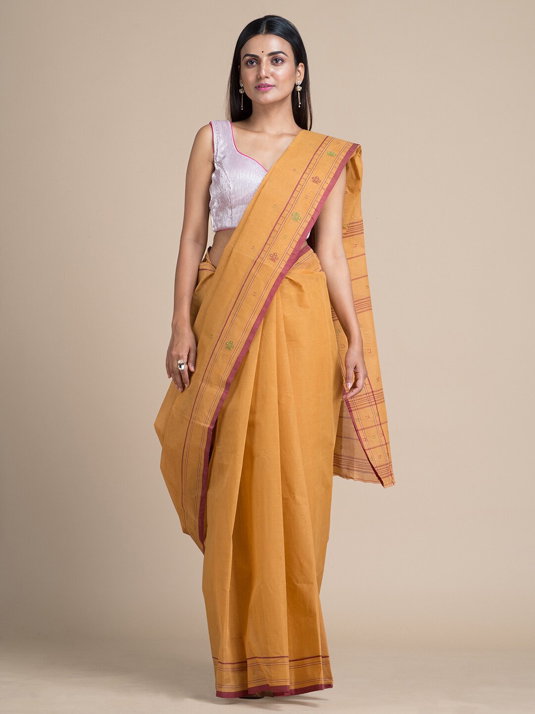

Mitera Mustard Pure Cotton Solid Taant Saree