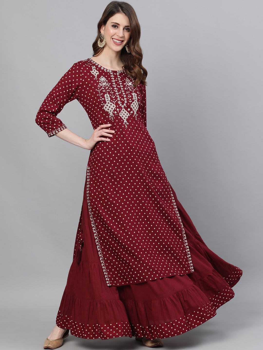 

Ishin Women Maroon & Silver Ethnic Motifs Kurta with Skirt