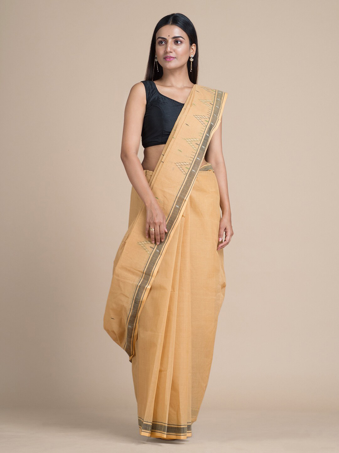 

Mitera Beige Pure Cotton Solid Taant Saree