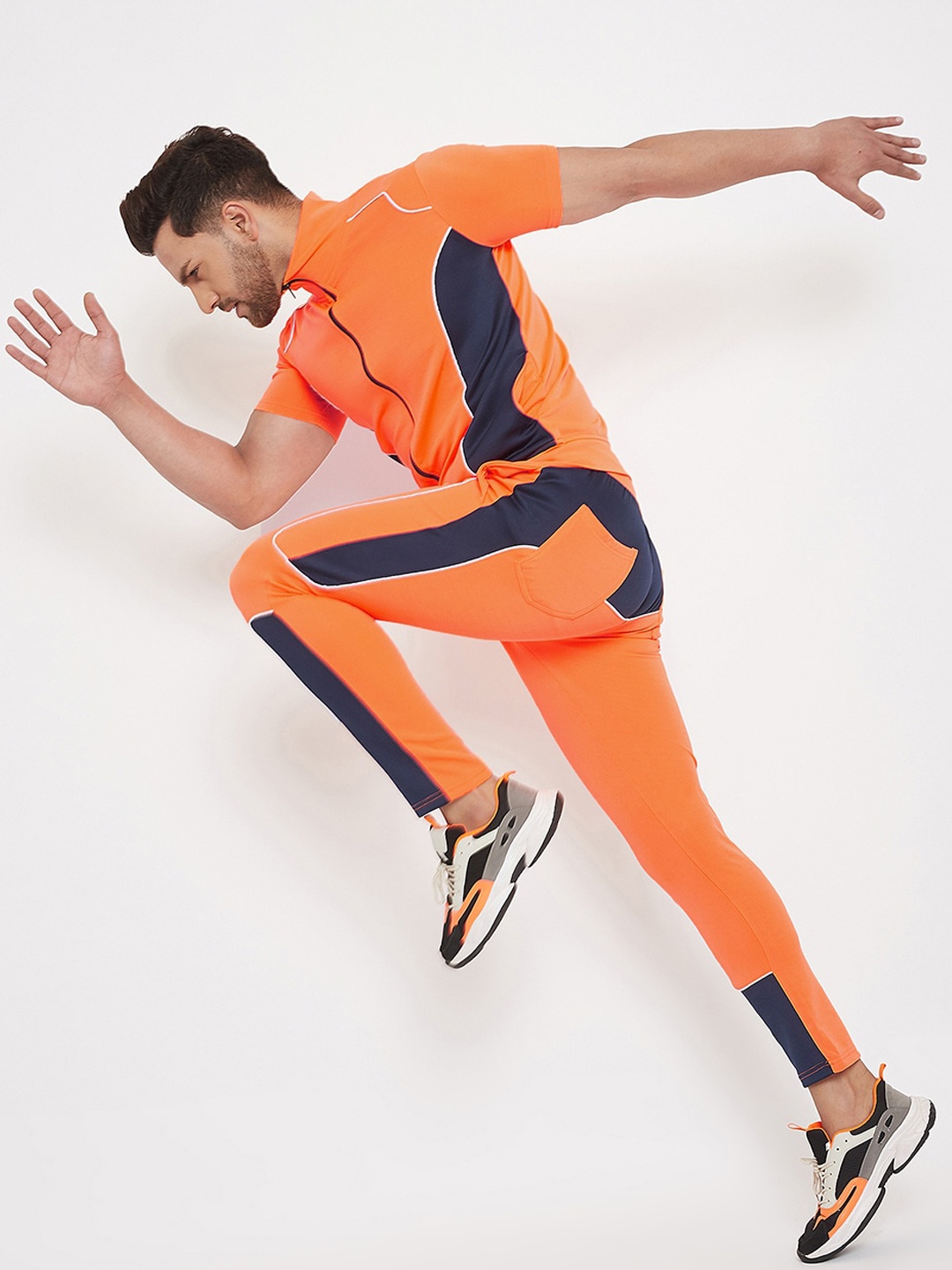 

FUGAZEE Men Orange & Black Colourblocked Slim-Fit Track Suit