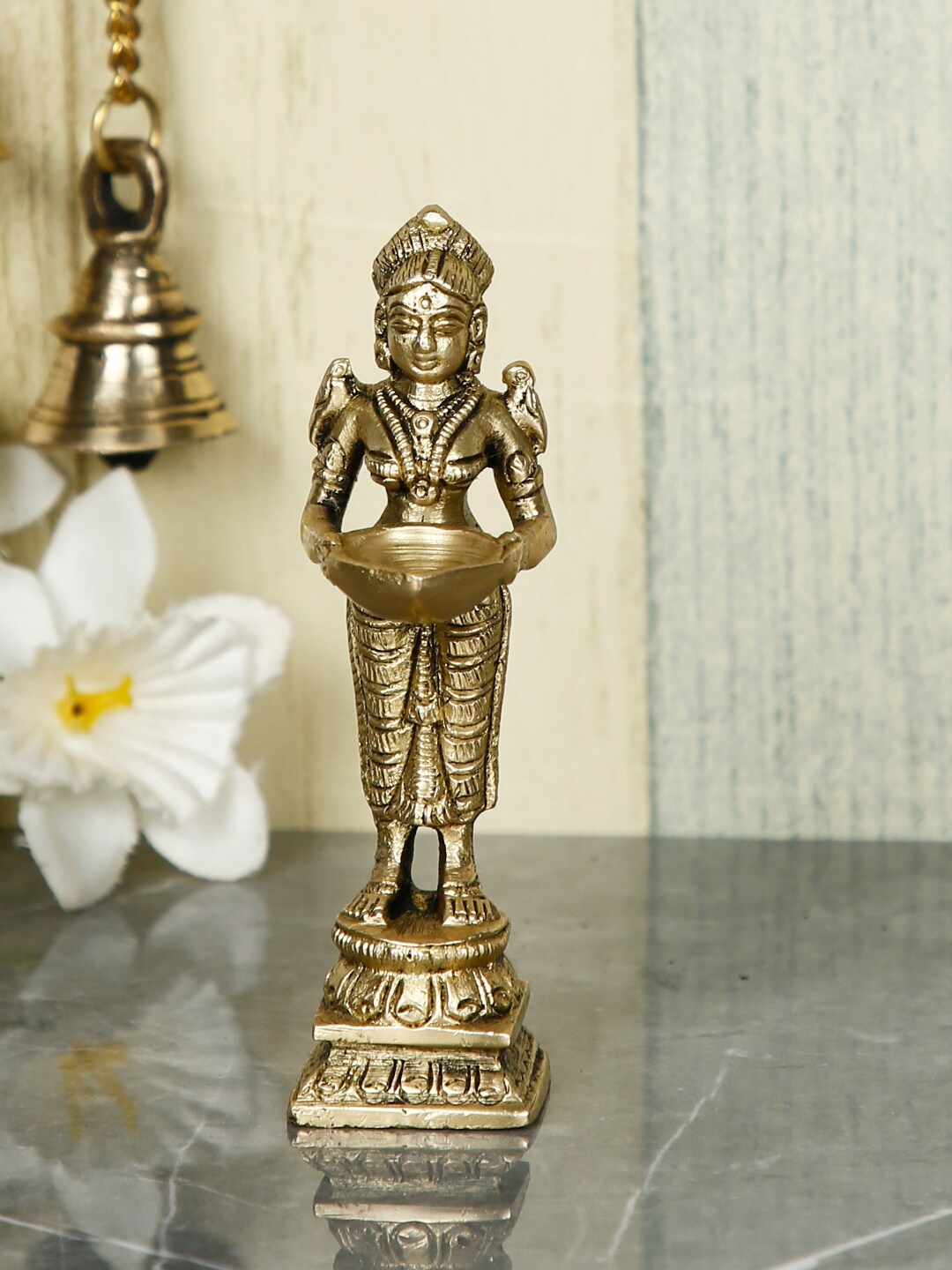 

CraftVatika Gold-Toned Lady Holding Lamp Diya Candles Showpiece