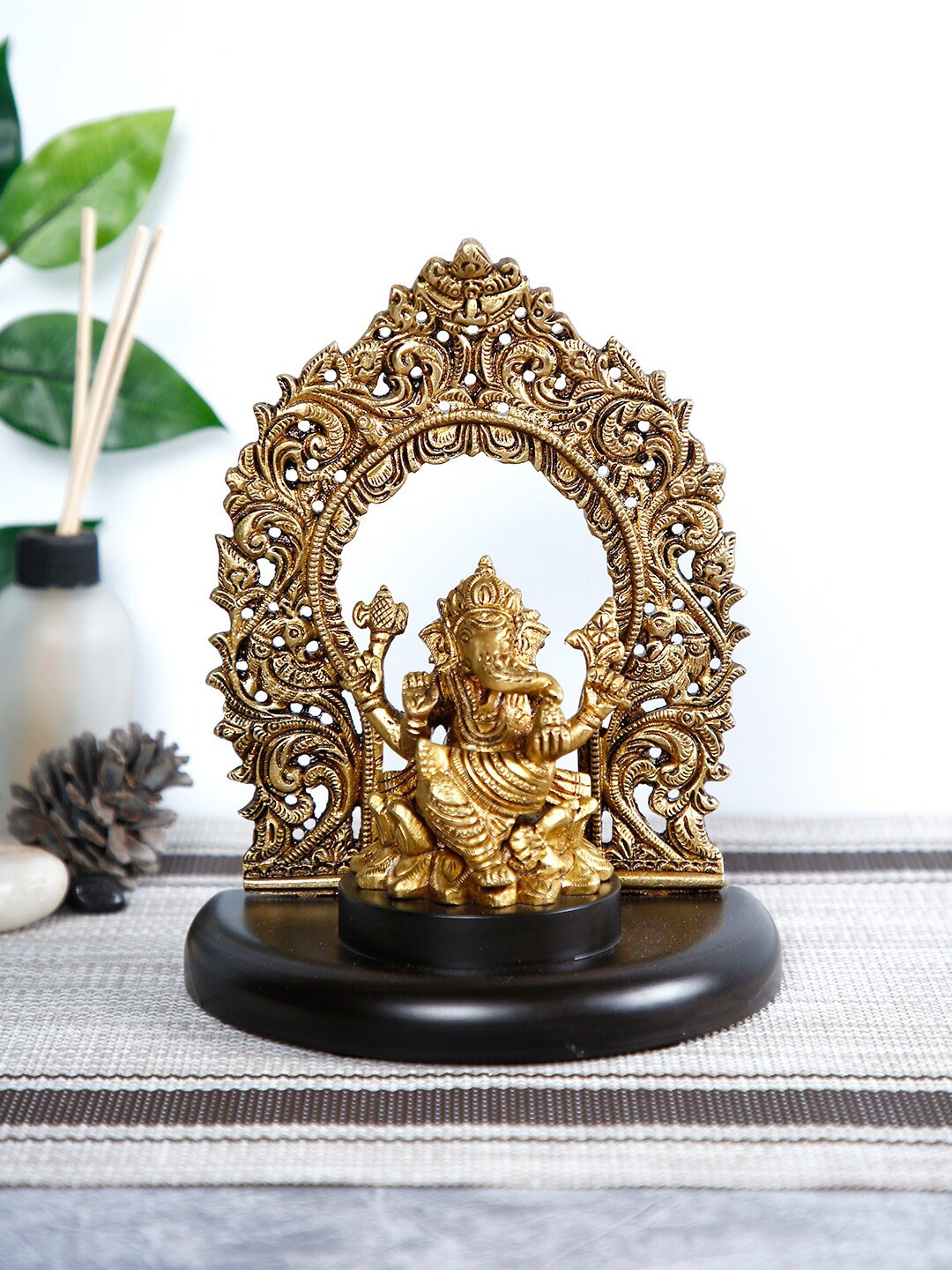 

CraftVatika Gold-Toned & Brown Ganesh Idol Showpiece With Wooden Base
