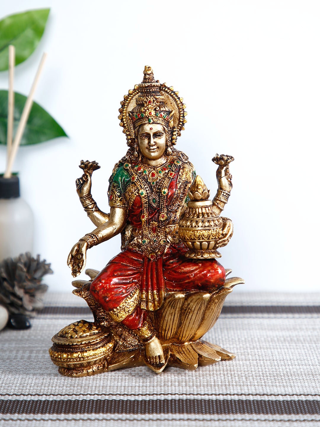 

CraftVatika Gold-Toned & Red Lakshmi Devi Idol Handpainted Showpiece