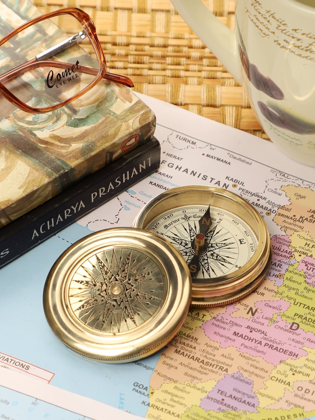 

EXIM DECOR Gold-Toned Printed Robert Frost Poem Compass Showpiece