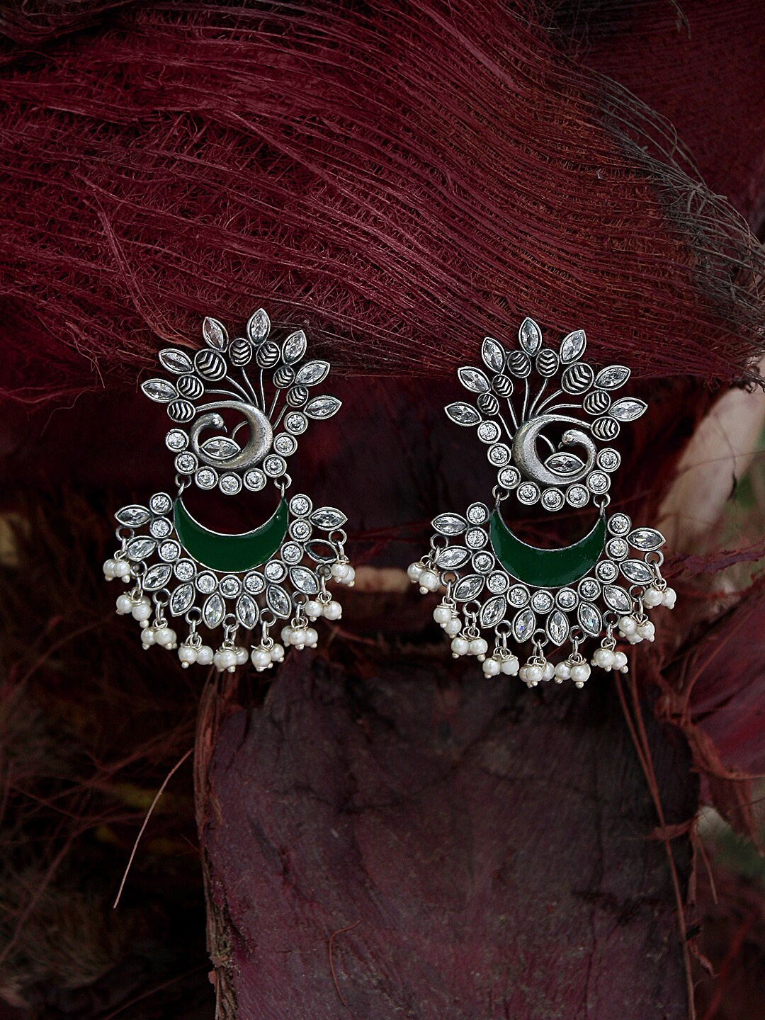 

Adwitiya Collection Silver-Plated & Green Peacock Shaped Chandbalis
