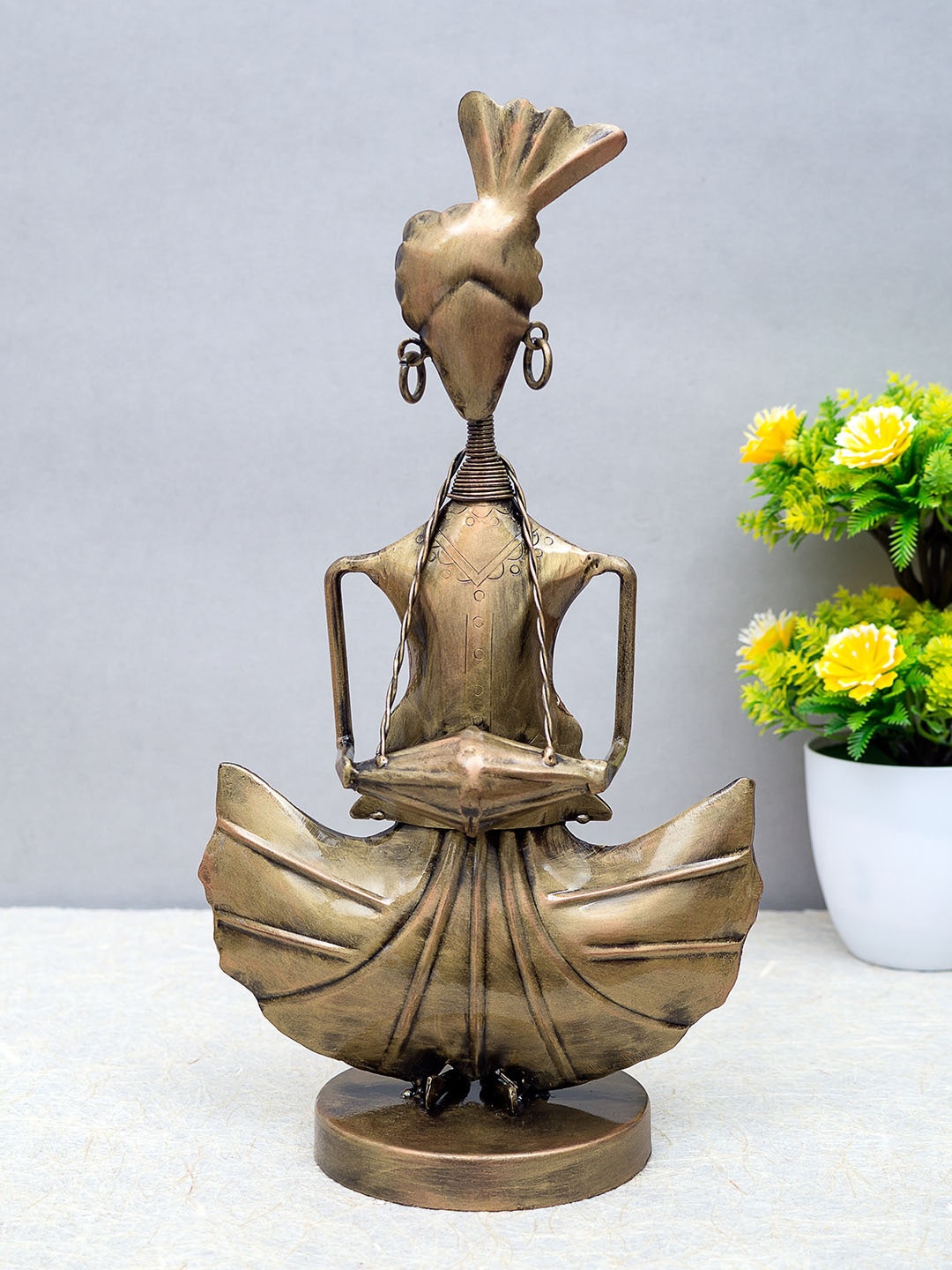 

Golden Peacock Gold-toned Handcrafted Dholak Musician Figurine