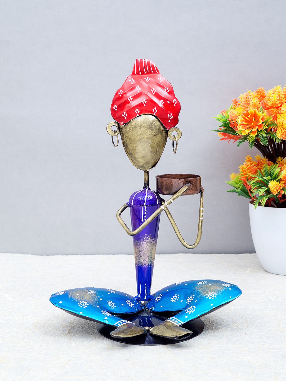 

Golden Peacock Blue & Red Sitting Turban Man Handcrafted Showpiece