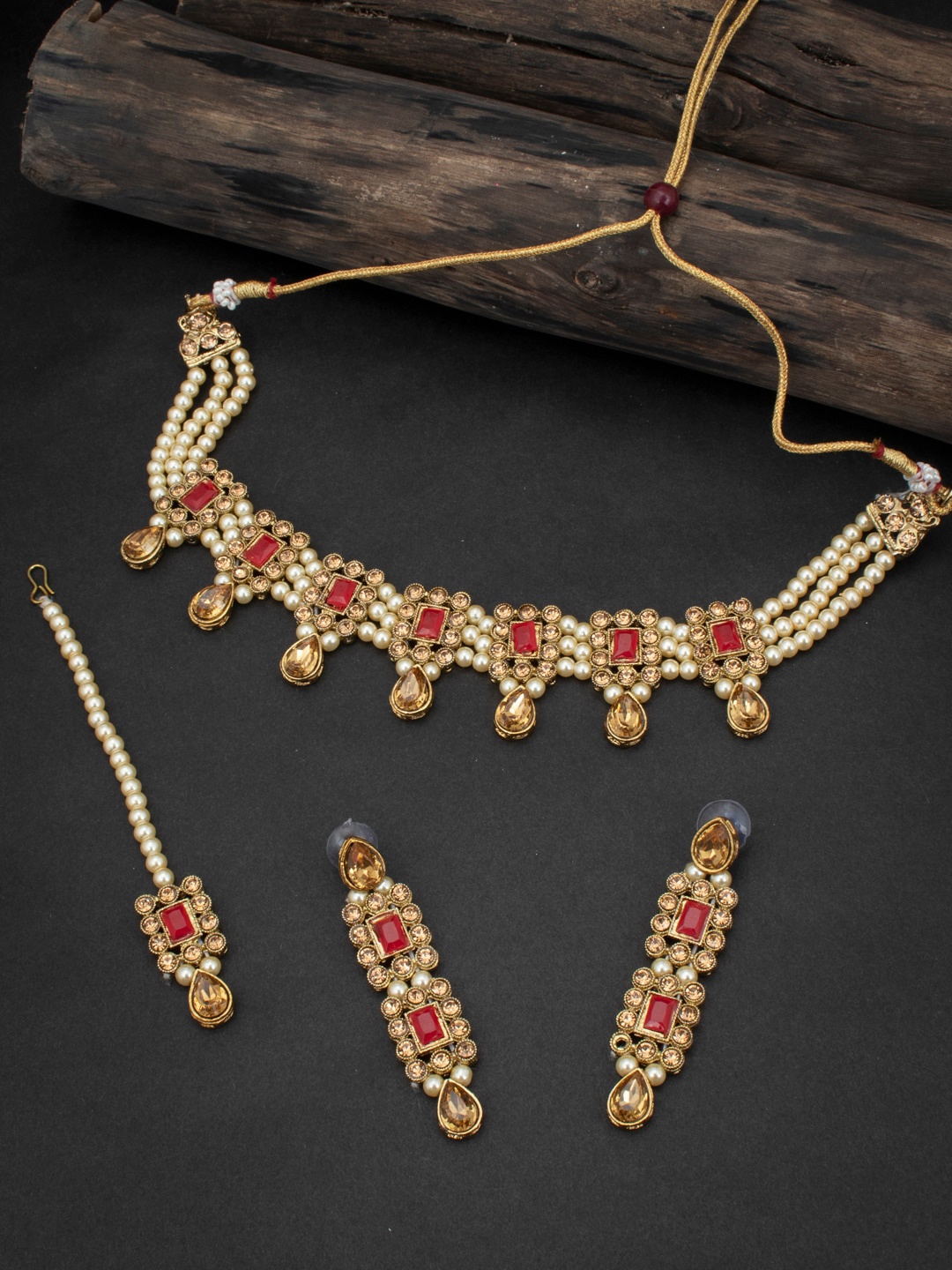 

Sukkhi Gold Plated Red Stone Studded & White Pearl Beaded Sustainable Jewellery Set