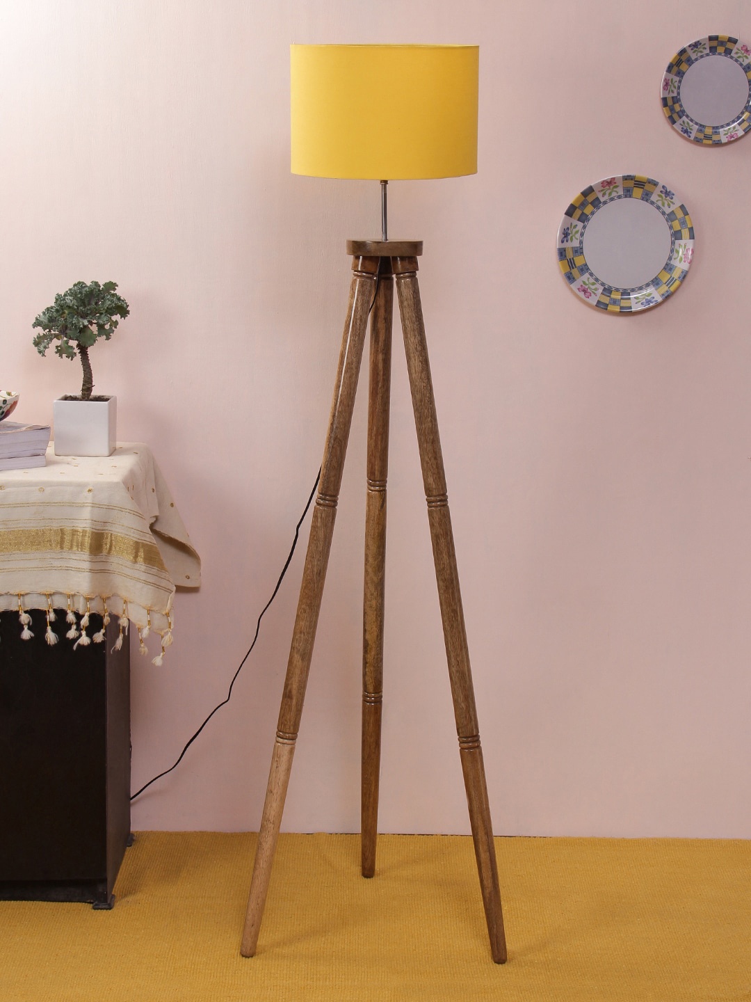 

Devansh Yellow & Brown Solid Traditional Cylindrical Tripod Lamp