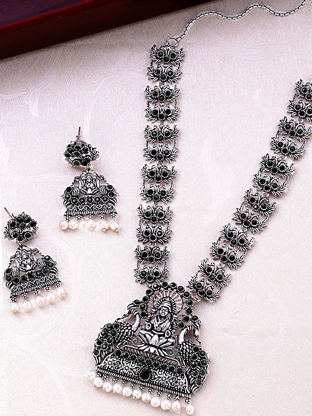 

Yellow Chimes Oxidised Silver-Plated Black Stone-Studded Lakshmi Jewellery Set