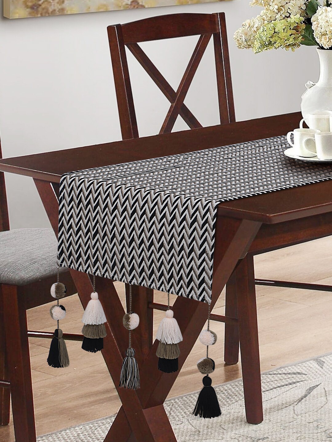 

Mezposh Black & Off-White Embroidered 4-Seater Table Runner With Tassels