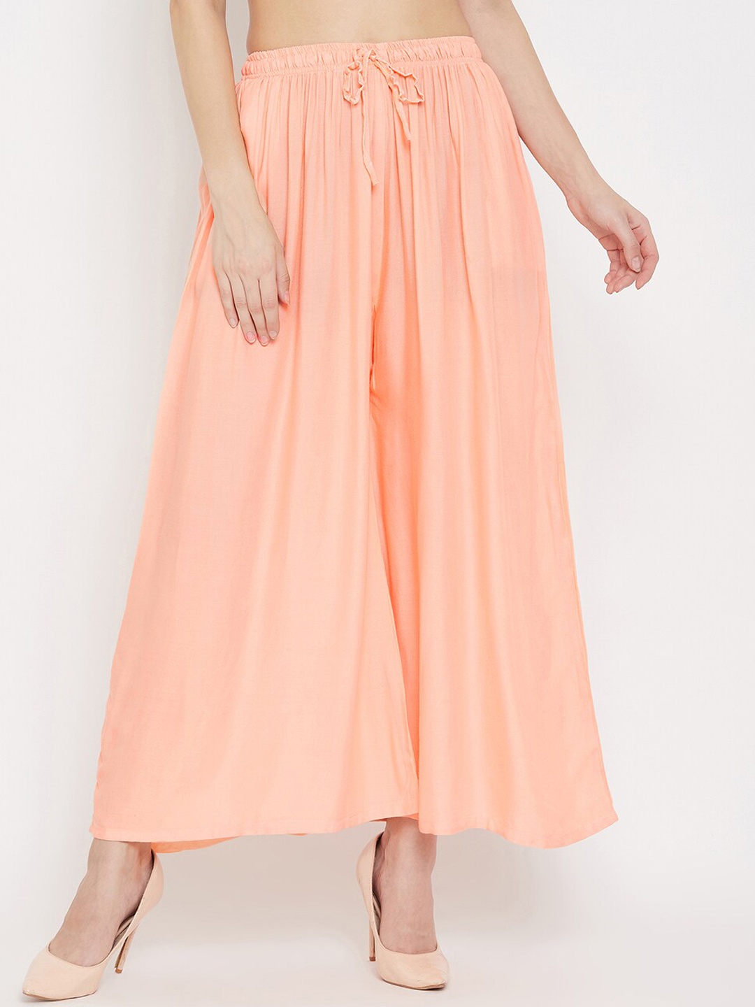 

Clora Creation Women Peach-Coloured Solid Flared Palazzos