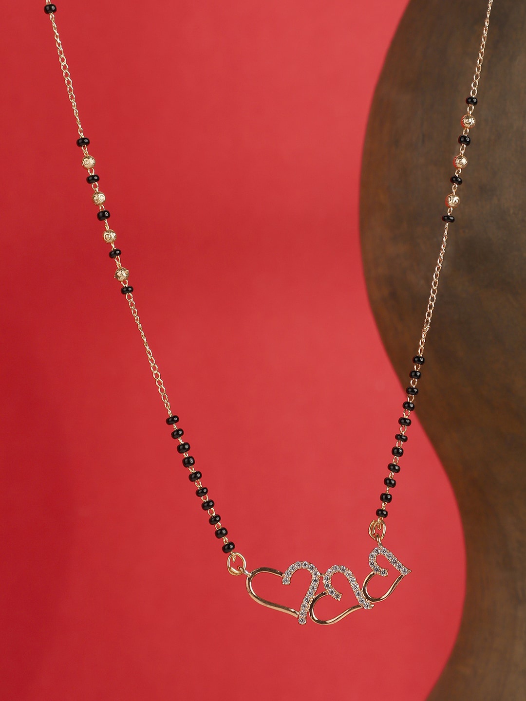 

ANIKAS CREATION Gold-Plated Black & White AD-Studded Beaded Mangalsutra