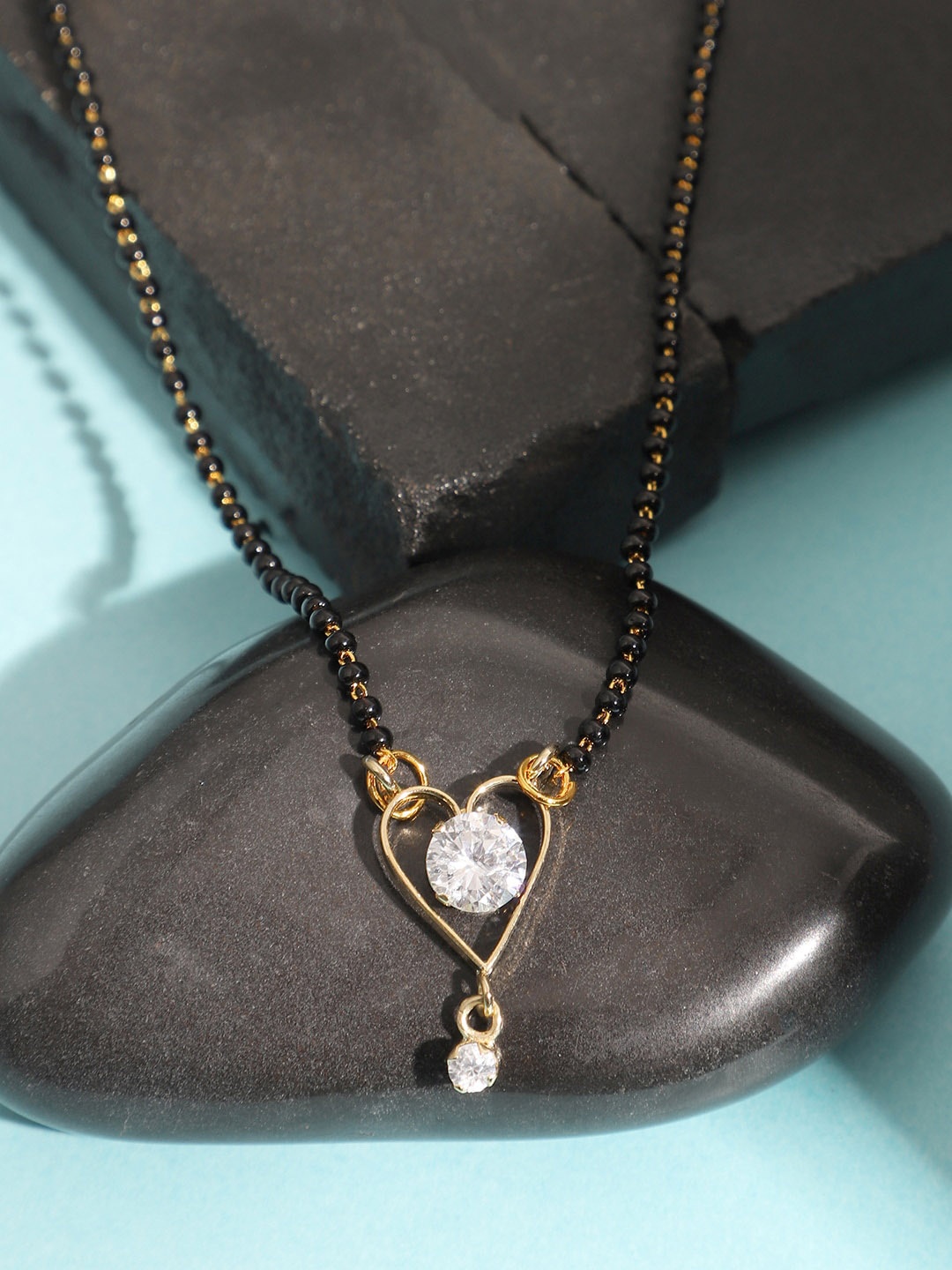 

ANIKAS CREATION Gold-Plated Black & White Stone-Studded & Beaded Mangalsutra